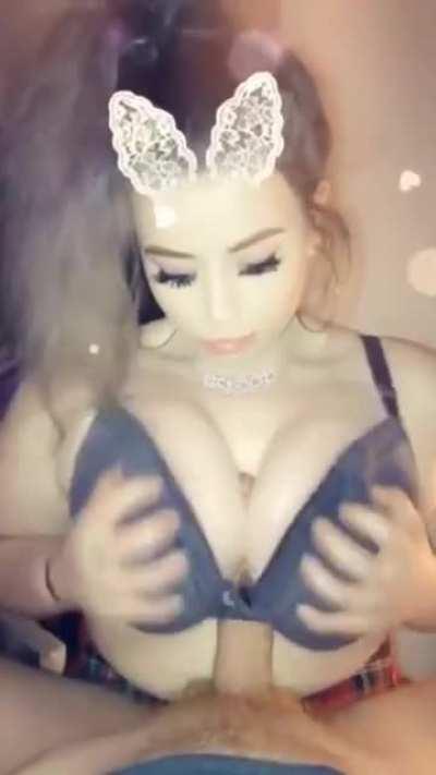 Squished between big tits in a bra