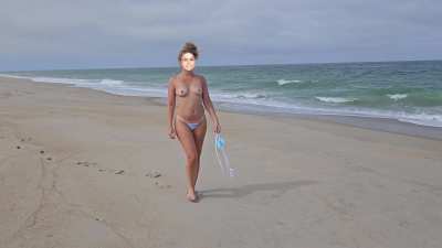 Topless on a public beach [f]