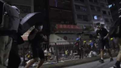 (got taken down so I posted again) Camera man puts themselves in the middle of a charge during a hong kong protest and still gets incredible footage