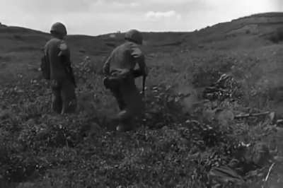 North Korean troops concealed in the undergrowth hunted down by US 1st Division Marines in September 1950 following the Han River crossing