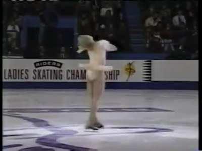 Denise Biellmann creator of the Biellmann spin, doing the Biellmann into a headless scratch spin in 1995.