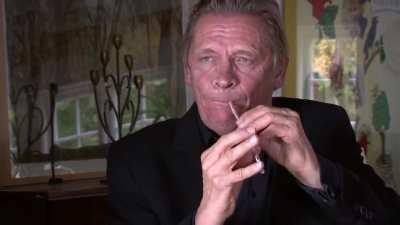 Peter Bastian playing a straw like a double reed instrument