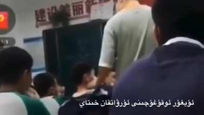 Teacher in Xinjiang school slaps a Uyghur student for 11 times, even pulling his mask off