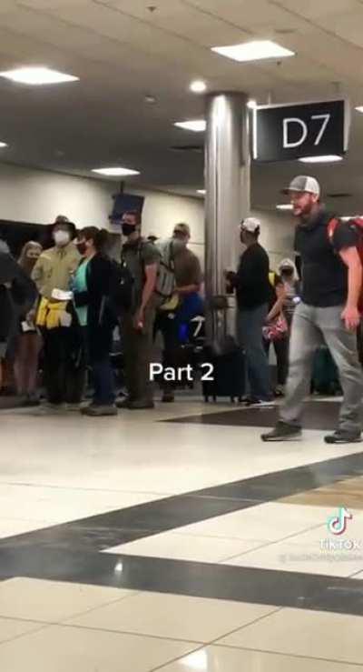 Antimask dumbfuck has a meltdown at the airport and demands that people rIsE uP!