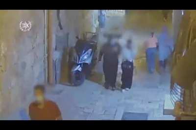 Guy with a knife tries to stab a soldier who is holding a gun