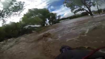 WCGW crossing a flash flood on a motorcycle