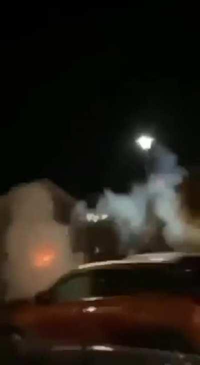 Idiot holding a firework.