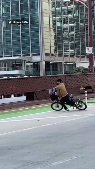 At one point, the cyclist drops his phone and is chased after retrieving it.