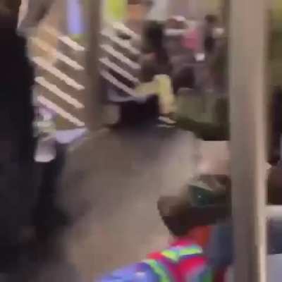 Little person dressed as Chucky messing with people on the subway