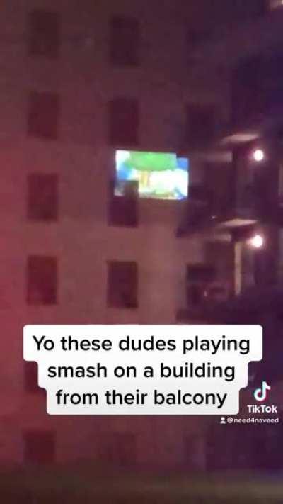 Saw these guys projecting smash on a building playing from their balcony