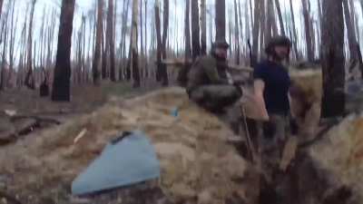 Archive footage of Brazilian soldiers digging trenches on the Kreminna front, when Russian mortar shell hit the area. No one was injured on that occasion.