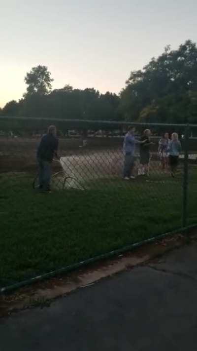 Two women try to stop man from doing his job