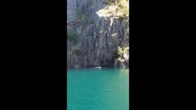 Idiot nearly falls off of a cliff