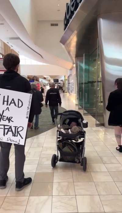 Woman forces husband to parade around in public while wearing a sign exposing his cheating ways 