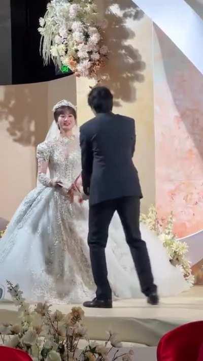 The bride is dead inside while the groom is a little bit too excited.