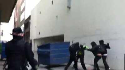 Group of antifa chase a retreating man into an alley and beat him while their comrades tried to stop journalists from filming.