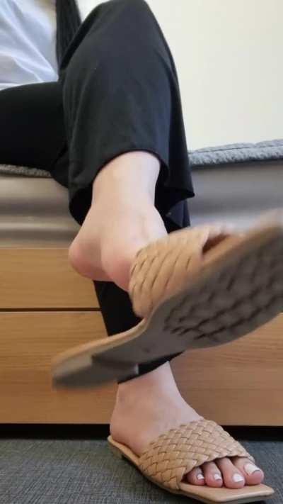 A wild Korean girl dangles her shoes