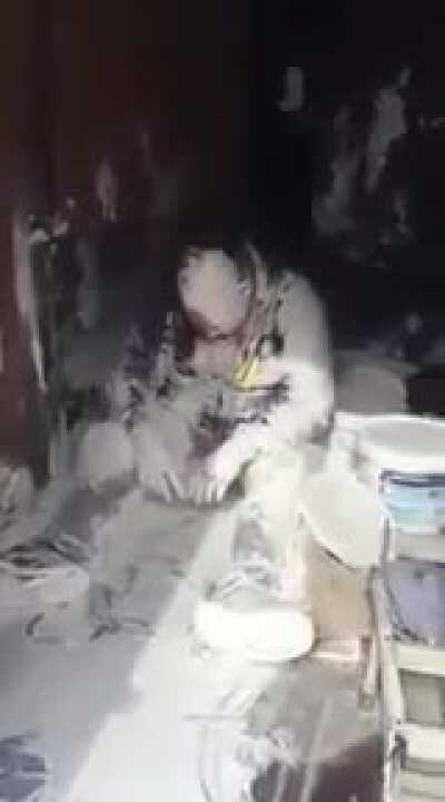 John is angry and covered in paint in the back of van