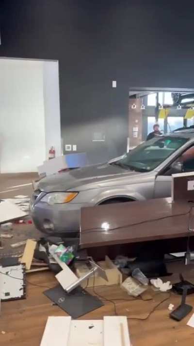 Guys Crashes Purchased Car into Dealership
