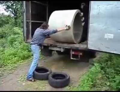 Let’s just move this huge piece of concrete by rolling it out of a van.