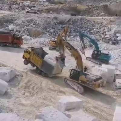 Perfect handling of machinery to transport one massive chunk of rock