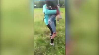 Kid holds onto kite string, falls down