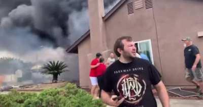 Neighbors help people out of home that was hit by a plane in Santee