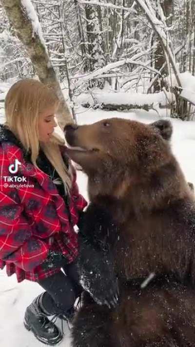 Russian girl feeding her pet