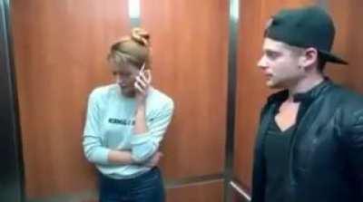 She got caught taking a picture of him thanks to the flashlight