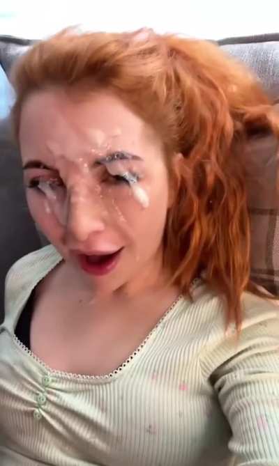 Sexy redhead gets a thick facial