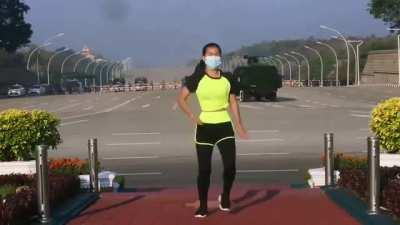 This woman from Myanmar was recording her aerobics class. Unbeknownst to her, she records the military Junta arriving to the parliament for a coup d'etat in the background