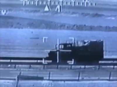 AH-64 Apache attack helicopter taking out Iraqi trucks and artillery with its 30mm cannon, Operation Desert Storm (2/27/1991)