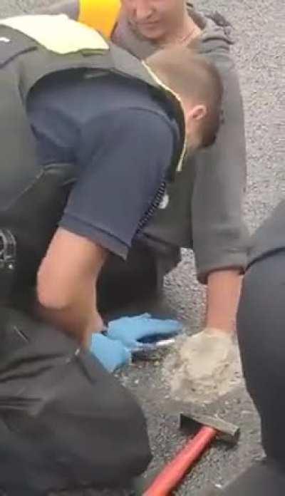 Climate Change Activist cemented their hand in the middle of the road causing traffic jam