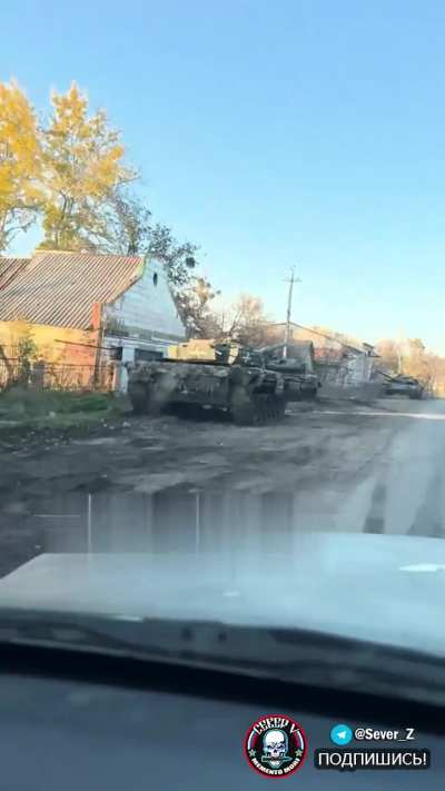 RU POV: Road littered with destroyed - abandoned Ukrainian tanks. no location given.