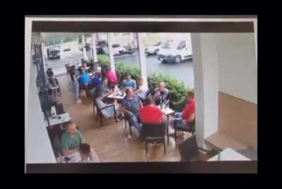 Car crashing in gas station café