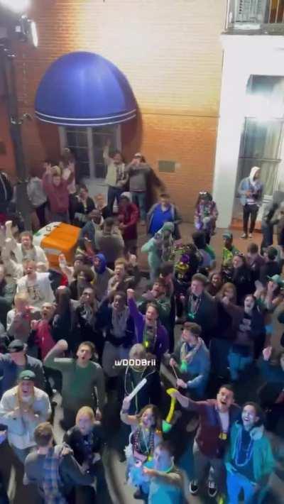 Flashing my tits to the crowd down below!