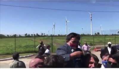 President holds a dwarf thinking he is a child.