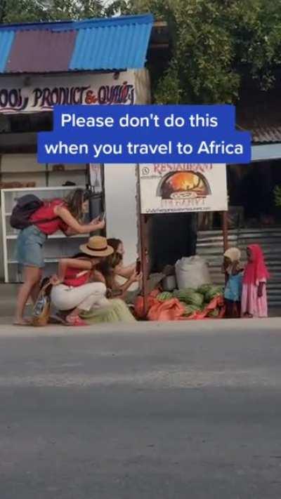 Tourist taking pictures of children