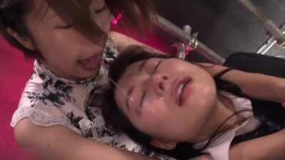 Spitting on her submissive friend