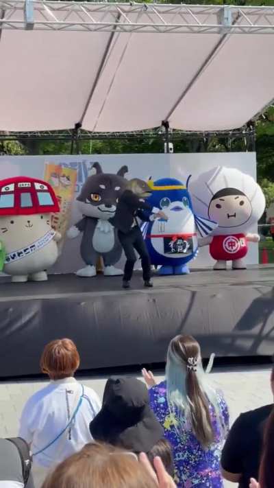 PR chief of Kanoya City, Japan, dancing wearing the head of an amberjack.