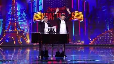 President of Ukraine Zelensky playing the piano with his huge fucking balls