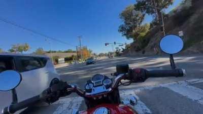 Biker gets hit by truck, after it is rammed by a stolen vehicle at high speed.