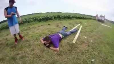 WCGW riding a sheet of wood behind a truck