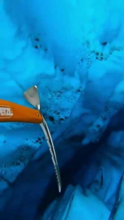 Clear, deep water beneath a glacier