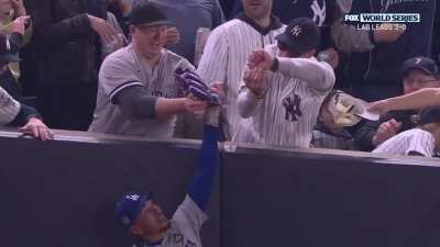 Yankee fan tried to take the ball out of Mookie Betts' glove after an out. 