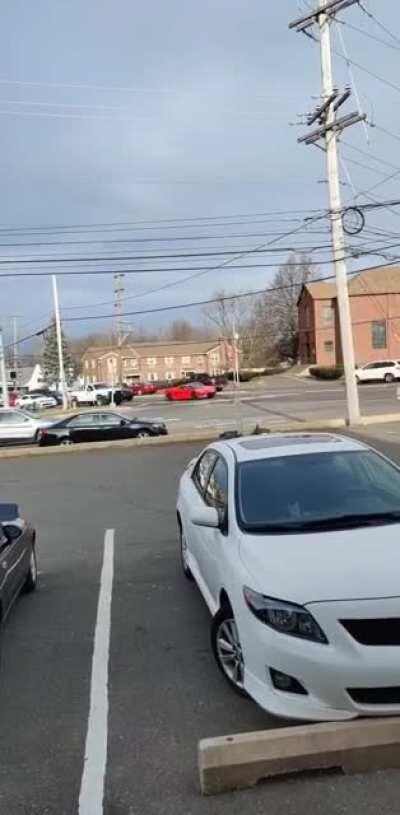 Sitting at work and I spotted this red sports car.