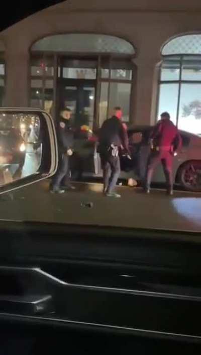 Dude fights off 3 cops at once, then drives off in a car while being tazed