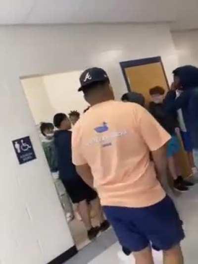 Instigator of the year award to the kid in beige.