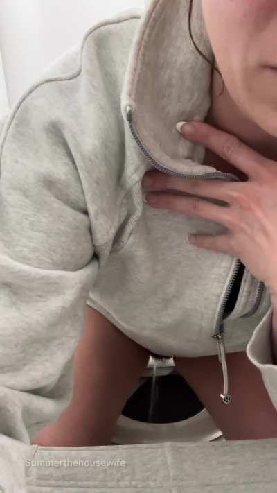 Taking a pee in the tiny airplane bathroom