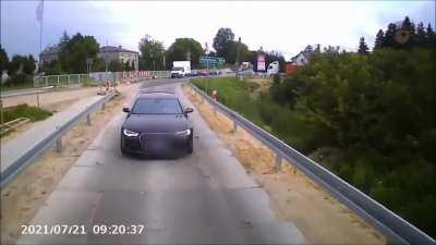 When an Audi motorist runs a red light, he receives Instant Karma.